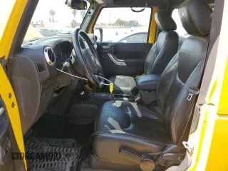 2015 Jeep Wrangler Rubicon Hard Rock with VIN 1C4BJWCG6FL568665, listed as a Copart auction lot 60282155 with 107,773 mi miles and Salvage title. Bid and sale history available at DreamBid. Image 7.