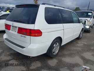 2000 Honda Odyssey EX z VIN 2HKRL1863YH589248, wystawiony jako IAAI lot #41735692 z przebiegiem 164 677 mil mil oraz . Historia ofert i sprzedaży dostępna na DreamBid. Obrazek 4.