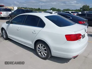 2014 Volkswagen Jetta SE with VIN 3VWD07AJ2EM444256, listed as a IAAI auction lot 42383287 with 99,654 mi miles and . Bid and sale history available at DreamBid. Image 3.