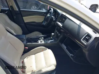 2015 Mazda 6 i Grand Touring with VIN JM1GJ1W50F1204322, listed as a IAAI auction lot 40694216 with 141,357 mi miles. Bid and sale history available at carsss.com. Image 5.