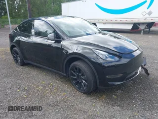 2023 Tesla Model Y Long Range z VIN 7SAYGDEE2PF885116, wystawiony jako IAAI lot #40091902 z przebiegiem 11 779 mil mil oraz . Historia ofert i sprzedaży dostępna na DreamBid. Obrazek 1.