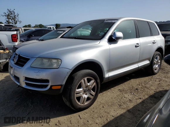 2004 Volkswagen Touareg z VIN WVGCM77L44D054387, wystawiony jako Copart lot #56009024 z przebiegiem 182 816 mil mil oraz Szkoda całkowita • Salvage title. Historia ofert i sprzedaży dostępna na DreamBid. Obrazek 1.