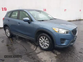 2016 Mazda CX-5 Sport with VIN JM3KE2BY7G0766124, listed as a IAAI auction lot 41857787 with 134,573 mi miles and . Bid and sale history available at DreamBid. Image 1.