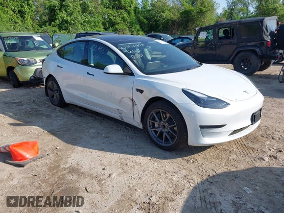2023 Tesla Model 3 with VIN 5YJ3E1EA3PF617460, listed as a IAAI auction lot 42154401 with 9,578 mi miles and . Bid and sale history available at DreamBid. Image 1.
