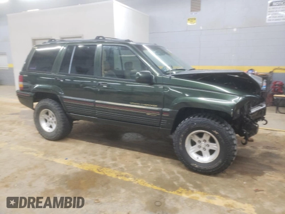 1995 Jeep Grand Cherokee Limited z VIN 1J4GZ78S7SC766726, wystawiony jako Copart lot #84909134 z przebiegiem 174 256 mil mil oraz Szkoda całkowita • Salvage title. Historia ofert i sprzedaży dostępna na DreamBid. Obrazek 4.