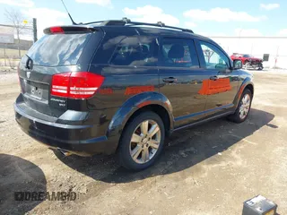 2010 Dodge Journey SXT with VIN 3D4PH5FV4AT135822, listed as a IAAI auction lot 42012480 with 124,480 mi miles and . Bid and sale history available at DreamBid. Image 4.