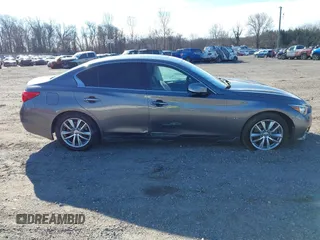 2015 Infiniti Q50 z VIN JN1BV7AR0FM397309, wystawiony jako IAAI lot #41752569 z przebiegiem 116 475 mil mil oraz . Historia ofert i sprzedaży dostępna na DreamBid. Obrazek 13.