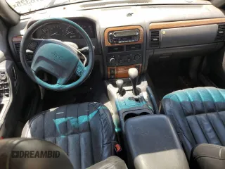 1999 Jeep Grand Cherokee Limited with VIN 1J4GW68N5XC549051, listed as a Copart auction lot 64376325 with 205,276 mi miles and Clean title. Bid and sale history available at DreamBid. Image 9.