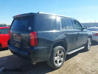 2017 Chevrolet Tahoe LS with VIN 1GNSCAKC8HR360581, listed as a IAAI auction lot 41365169 with 137,369 mi miles. Bid and sale history available at carsss.com. Image 4.