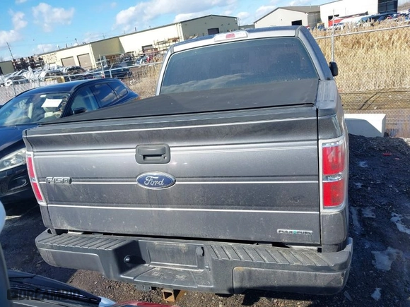 2014 Ford F-150 XL with VIN 1FTFW1EF2EFA76657, listed as a IAAI auction lot 41668284 with 130,226 mi miles. Bid and sale history available at carsss.com. Image 16.