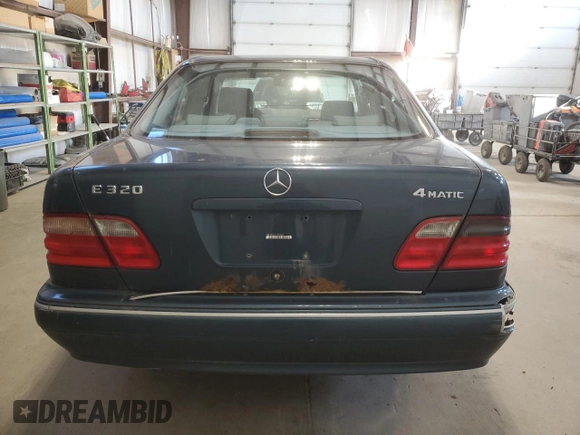 2000 Mercedes-Benz E-Class AWD with VIN WDBJF82G4YX027683, listed as a Copart auction lot 77146524 with 228,654 mi miles and Clean Title. Bid and sale history available at carsss.com. Image 6.