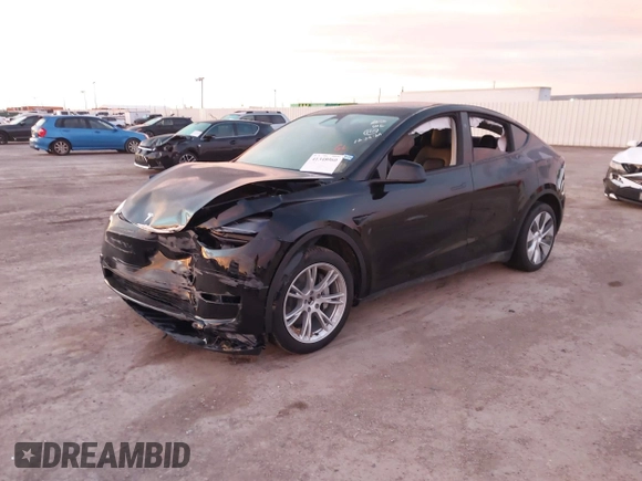 2023 Tesla Model Y Long Range z VIN 7SAYGDEE2PA166042, wystawiony jako IAAI lot #41348960 z przebiegiem Nie podano mil oraz . Historia ofert i sprzedaży dostępna na DreamBid. Obrazek 17.