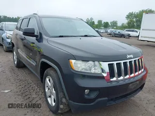2011 Jeep Grand Cherokee Laredo z VIN 1J4RR4GG3BC505615, wystawiony jako IAAI lot #42455554 z przebiegiem 186 399 mil mil oraz . Historia ofert i sprzedaży dostępna na DreamBid. Obrazek 1.
