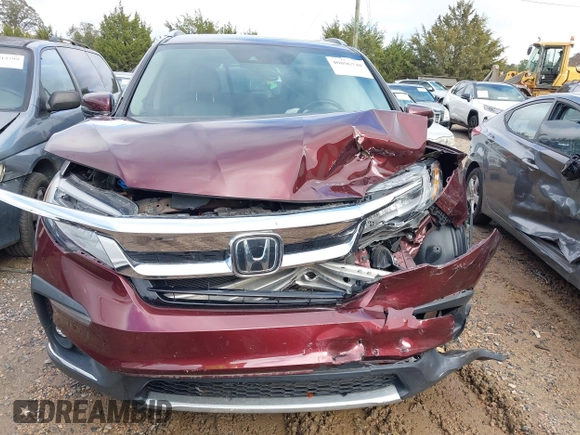 2020 Honda Pilot Touring 8-Passenger with VIN 5FNYF5H94LB012062, listed as a IAAI auction lot 40806740 with 115,431 mi miles and . Bid and sale history available at DreamBid. Image 12.