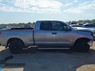 2011 Toyota Tundra with VIN 5TFRM5F18BX033833, listed as a IAAI auction lot 42257200 with 108,046 mi miles and . Bid and sale history available at DreamBid. Image 13.