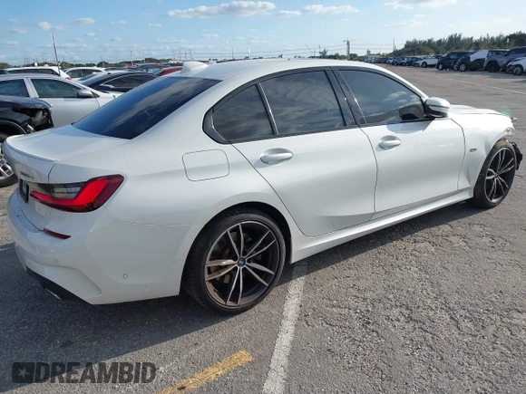 2022 BMW 3 Series 330e with VIN 3MW5P7J08N8C65252, listed as a IAAI auction lot 41229681 with 27,606 mi miles. Bid and sale history available at carsss.com. Image 4.