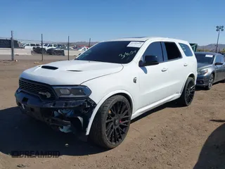2021 Dodge Durango SRT Hellcat with VIN 1C4SDJH96MC692601, listed as a IAAI auction lot 41764490 with 27,434 mi miles and . Bid and sale history available at DreamBid. Image 2.