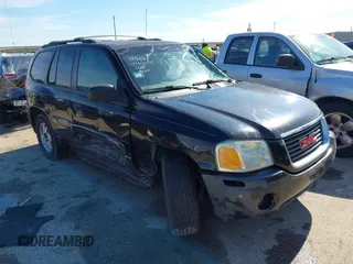 2003 GMC Envoy SLE with VIN 1GKDS13S732134354, listed as a IAAI auction lot 41305506 with 221,733 mi miles. Bid and sale history available at carsss.com. Image 1.