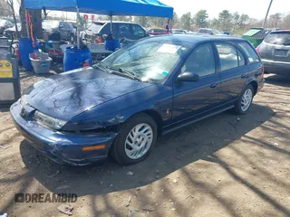 1999 Saturn SW z VIN 1G8ZK8274XZ254806, wystawiony jako IAAI lot #42105064 z przebiegiem 20 186 mil mil oraz . Historia ofert i sprzedaży dostępna na DreamBid. Obrazek 2.