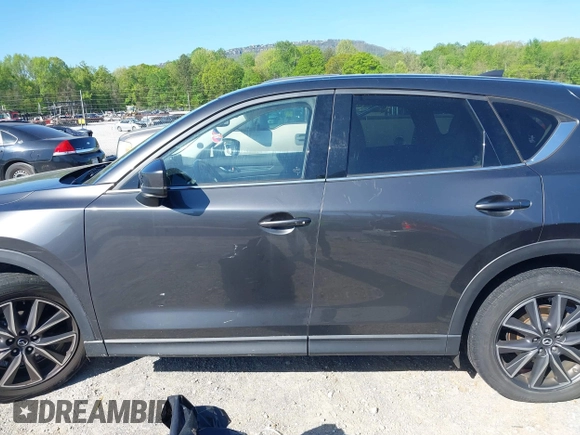 2018 Mazda CX-5 Grand Touring with VIN JM3KFBDM7J0454836, listed as a IAAI auction lot 42001397 with 146,879 mi miles. Bid and sale history available at carsss.com. Image 14.
