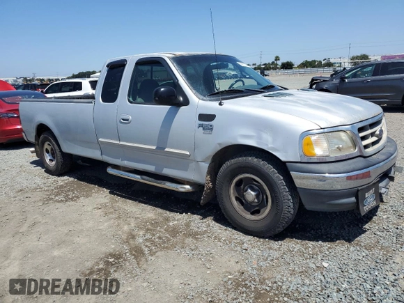 2001 Ford F-150 XL with VIN 1FTRX17W11NA24623, listed as a Copart auction lot 56767345 with 201,959 mi miles and Salvage title. Bid and sale history available at DreamBid. Image 4.