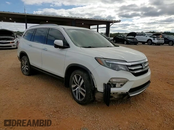 2017 Honda Pilot Touring z VIN 5FNYF6H92HB067140, wystawiony jako Copart lot #72200584 z przebiegiem 127 856 mil mil oraz Szkoda całkowita • Salvage title. Historia ofert i sprzedaży dostępna na DreamBid. Obrazek 11.