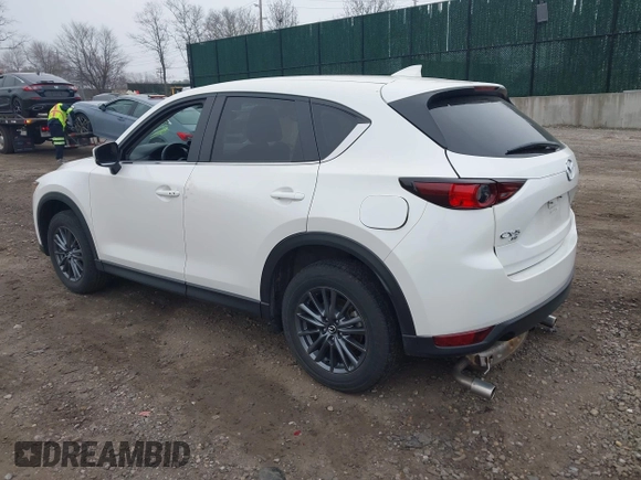 2021 Mazda CX-5 Touring with VIN JM3KFBCM1M1446313, listed as a IAAI auction lot 41930330 with 28,610 mi miles. Bid and sale history available at carsss.com. Image 3.