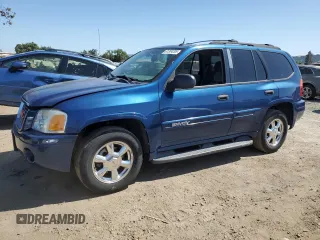 2005 GMC Envoy SLE z VIN 1GKDS13S452173325, wystawiony jako Copart lot #61304205 z przebiegiem 155 501 mil mil oraz Czysty tytuł • Clean title. Historia ofert i sprzedaży dostępna na DreamBid. Obrazek 1.