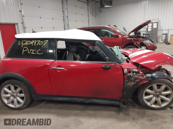2006 MINI Hardtop S with VIN WMWRE33536TL20807, listed as a IAAI auction lot 42049707 with Not provided miles and . Bid and sale history available at DreamBid. Image 13.