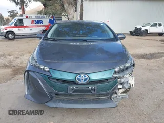 2018 Toyota Prius Plus with VIN JTDKARFPXJ3104302, listed as a IAAI auction lot 42127312 with 87,531 mi miles and . Bid and sale history available at DreamBid. Image 13.