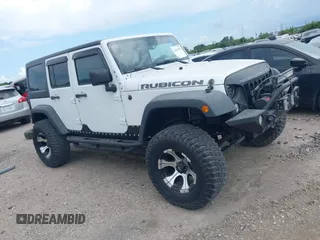 2011 Jeep Wrangler Unlimited Rubicon with VIN 1J4BA6H10BL536027, listed as a IAAI auction lot 42567901 with 164,487 mi miles and . Bid and sale history available at DreamBid. Image 1.