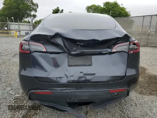 2024 Tesla Model Y z VIN 7SAYGDED4RF103411, wystawiony jako Copart lot #59982815 z przebiegiem 17 601 mil mil oraz Szkoda całkowita • Salvage title. Historia ofert i sprzedaży dostępna na DreamBid. Obrazek 6.