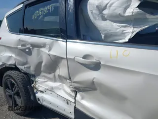 2013 Ford Escape SE with VIN 1FMCU9GXXDUB66562, listed as a IAAI auction lot 40287024 with 120,398 mi miles. Bid and sale history available at carsss.com. Image 6.