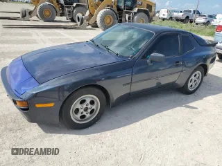 1987 Porsche 944 z VIN WP0AB0940HN475392, wystawiony jako Copart lot #76464204 z przebiegiem 156 624 mil mil oraz Szkoda całkowita • Salvage title. Historia ofert i sprzedaży dostępna na DreamBid. Obrazek 1.