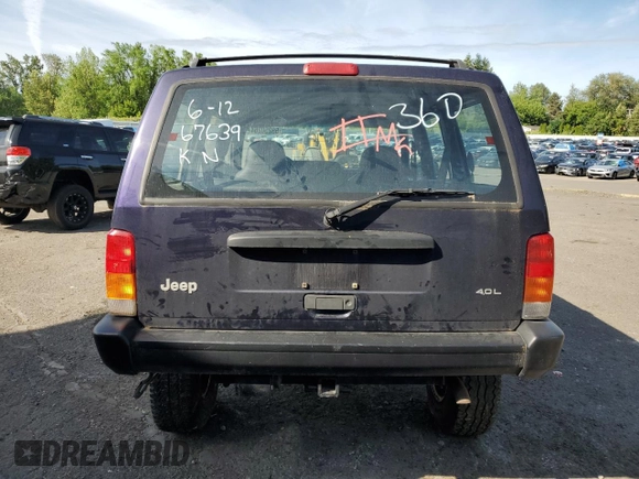 1999 Jeep Cherokee SE with VIN 1J4FF28S0XL541871, listed as a Copart auction lot 59250264 with Not provided miles and Salvage title. Bid and sale history available at DreamBid. Image 6.