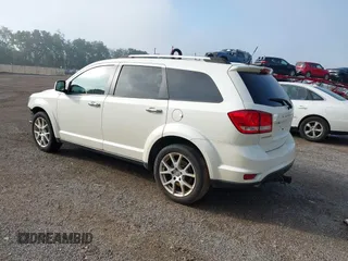 2013 Dodge Journey Crew with VIN 3C4PDCDG0DT591533, listed as a IAAI auction lot 42630548 with 164,961 mi miles and . Bid and sale history available at DreamBid. Image 3.