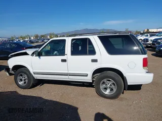 2001 Chevrolet Blazer LT z VIN 1GNCS13W712122865, wystawiony jako IAAI lot #41997035 z przebiegiem 161 862 mil mil oraz . Historia ofert i sprzedaży dostępna na DreamBid. Obrazek 14.