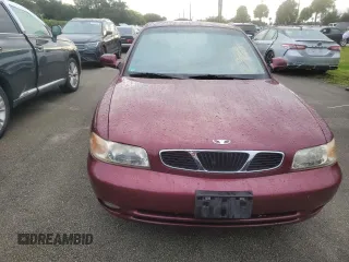 1999 Daewoo Nubira CDX z VIN KLAJB52Z5XK256700, wystawiony jako Copart lot #75085934 z przebiegiem Nie podano mil oraz Szkody całkowita. Historia ofert i sprzedaży dostępna na DreamBid. Obrazek 5.