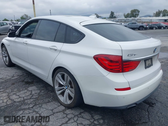 2011 BMW 5 Series GT 550i with VIN WBASN4C59BC210040, listed as a IAAI auction lot 42140088 with 130,771 mi miles. Bid and sale history available at carsss.com. Image 3.