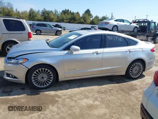 2014 Ford Fusion Titanium Hybrid with VIN 3FA6P0RU9ER147443, listed as a IAAI auction lot 41739540 with 146,359 mi miles. Bid and sale history available at carsss.com. Image 15.