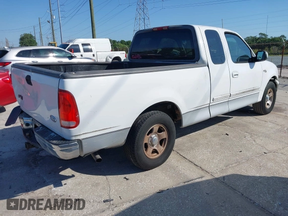2002 Ford F-150 XL with VIN 1FTRX17WX2NA92467, listed as a IAAI auction lot 41977334 with 176,902 mi miles. Bid and sale history available at carsss.com. Image 4.