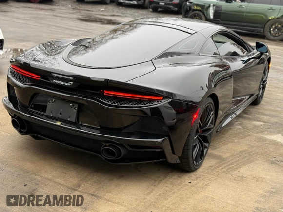 2023 McLaren GT z VIN SBM22GCA3PW002548, wystawiony jako Copart lot #52157855 z przebiegiem 779 mil mil oraz Szkody całkowita. Historia ofert i sprzedaży dostępna na DreamBid. Obrazek 9.