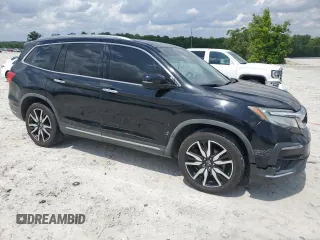2019 Honda Pilot Touring 8-Passenger with VIN 5FNYF5H94KB029572, listed as a Copart auction lot 54363265 with 149,825 mi miles and Salvage Title. Bid and sale history available at carsss.com. Image 4.