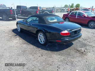 2002 Jaguar XK with VIN SAJDA42C12NA30499, listed as a IAAI auction lot 41954577 with 77,152 mi miles and . Bid and sale history available at DreamBid. Image 3.