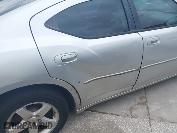 2010 Dodge Charger SXT with VIN 2B3CA3CV2AH227658, listed as a IAAI auction lot 42101656 with 162,392 mi miles. Bid and sale history available at carsss.com. Image 6.