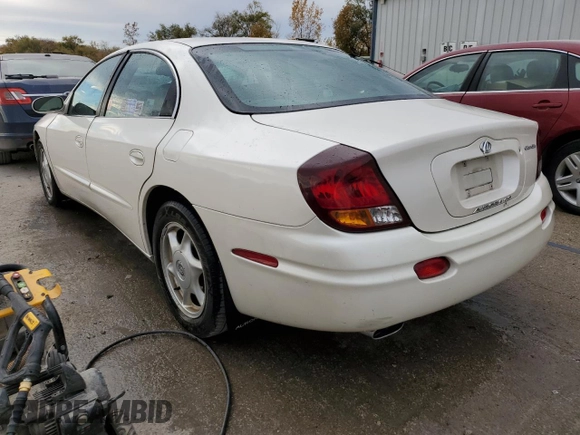 2003 Oldsmobile Aurora z VIN 1G3GS64C834100084, wystawiony jako Copart lot #76966704 z przebiegiem 70 263 mil mil oraz Szkody całkowita. Historia ofert i sprzedaży dostępna na DreamBid. Obrazek 2.
