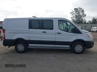 2021 Ford Transit Cargo with VIN 1FTBR1Y85MKA69355, listed as a IAAI auction lot 42544780 with 33,288 mi miles and . Bid and sale history available at DreamBid. Image 13.