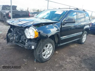 2009 Jeep Grand Cherokee Laredo with VIN 1J8GR48K99C550822, listed as a IAAI auction lot 41868508 with 179,436 mi miles. Bid and sale history available at carsss.com. Image 18.