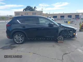 2021 Mazda CX-5 Grand Touring with VIN JM3KFBDM4M1426197, listed as a IAAI auction lot 42004644 with 43,814 mi miles. Bid and sale history available at carsss.com. Image 14.