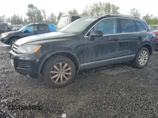 2011 Volkswagen Touareg Sport z VIN WVGFF9BP8BD006837, wystawiony jako Copart lot #57694565 z przebiegiem 149 951 mil mil oraz Tytuł czysty. Historia ofert i sprzedaży dostępna na DreamBid. Obrazek 1.